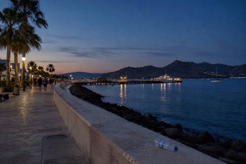 Clear evening sky over the water and hills at the edge of the bay at La Paz